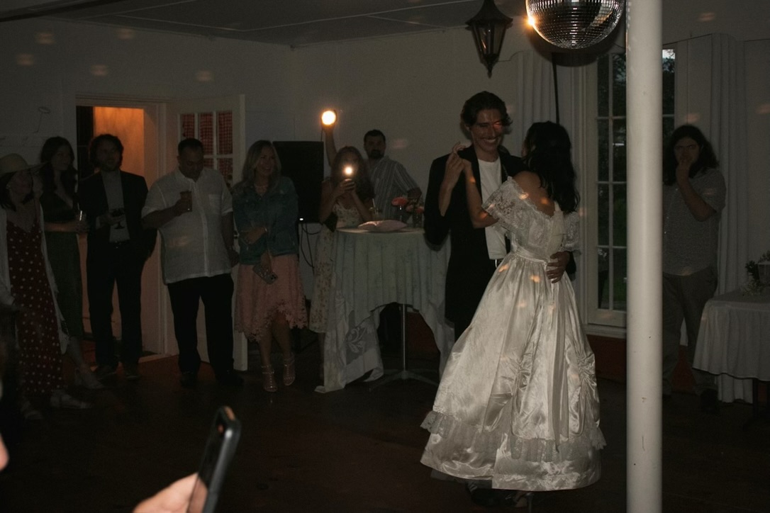 The couple dancing beneath the disco ball