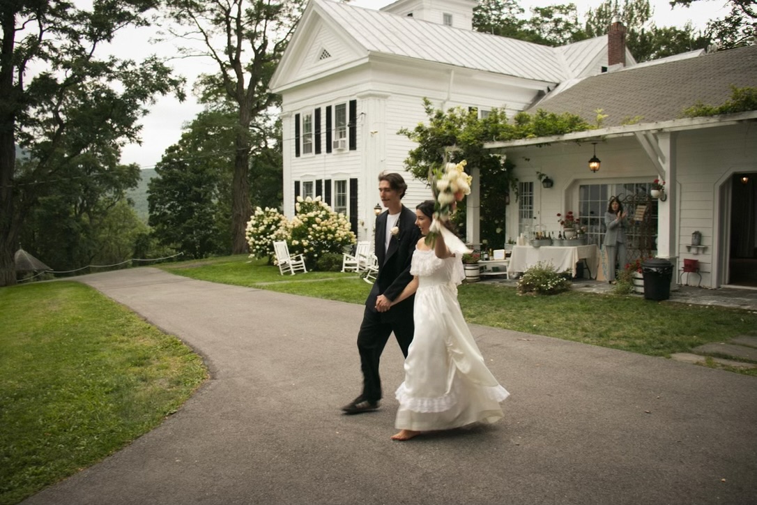 Newlyweds celebrating outside Durham White House