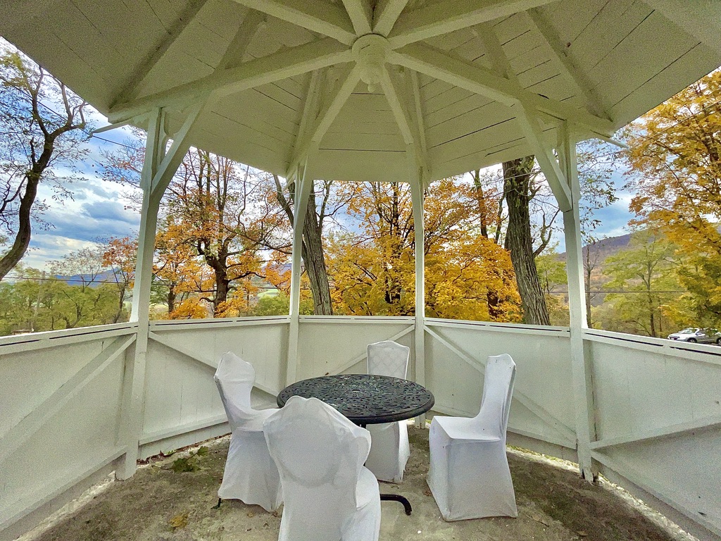 A quiet gazebo overlooking autumn foliage
