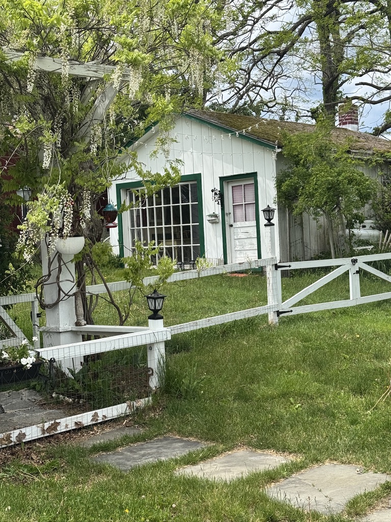 Garden cottage with green trim