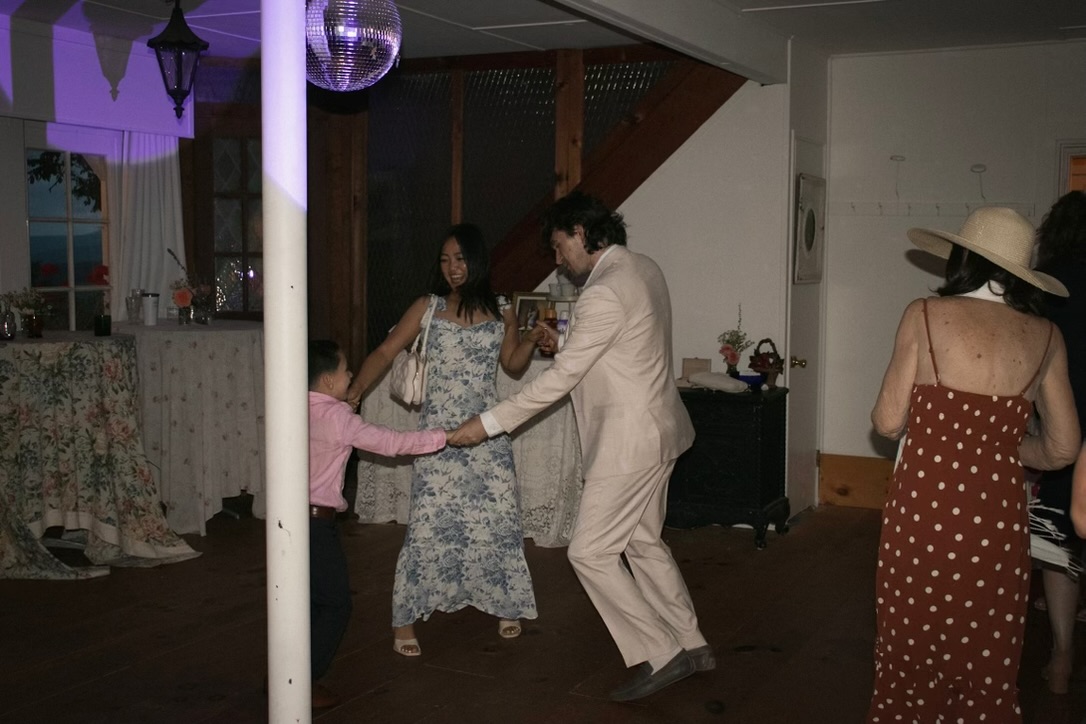 Guests dancing together at the reception