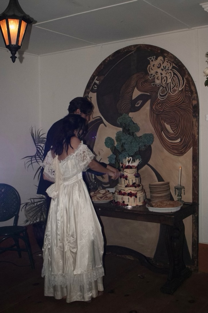 Cutting the wedding cake in the gathering room