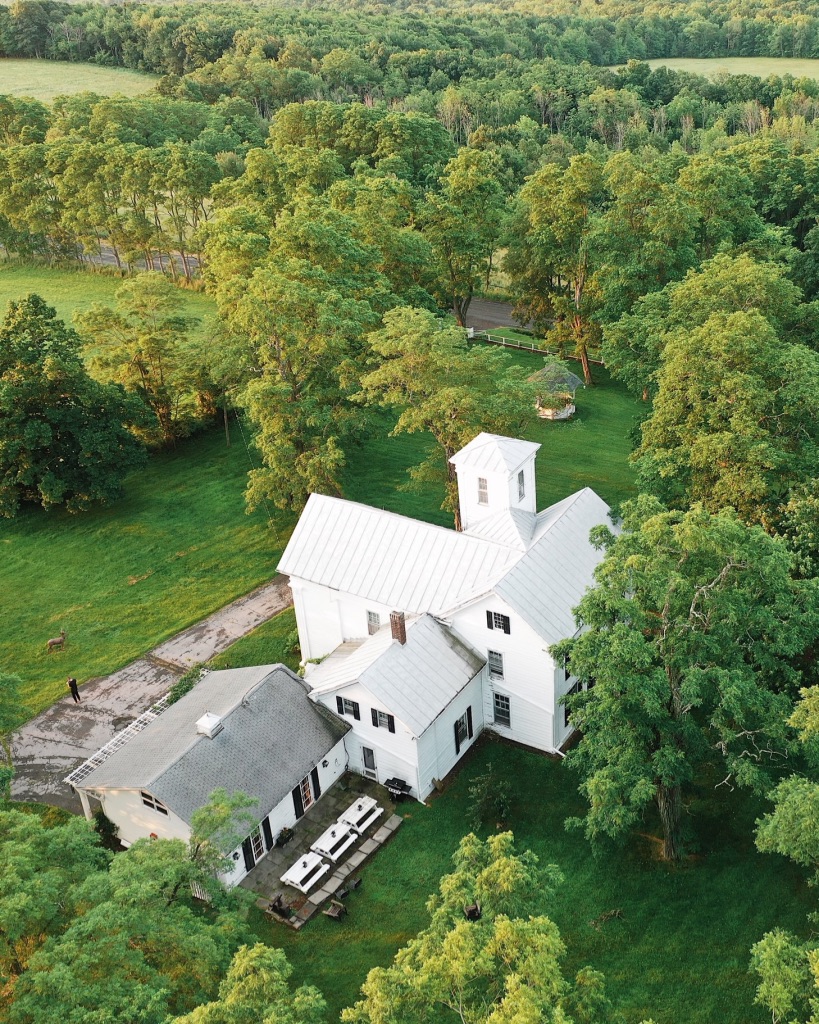 Aerial view of the house and surrounding woodland