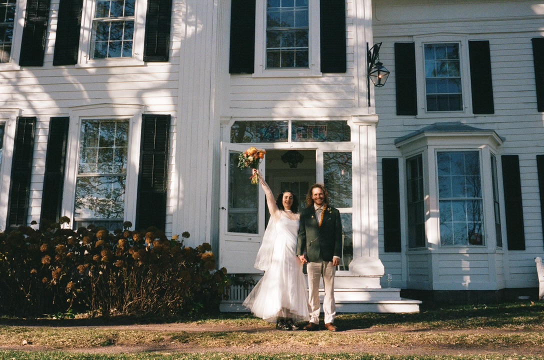 Newlyweds celebrating at the front door