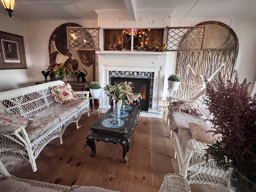 The fireplace and antique wicker seating