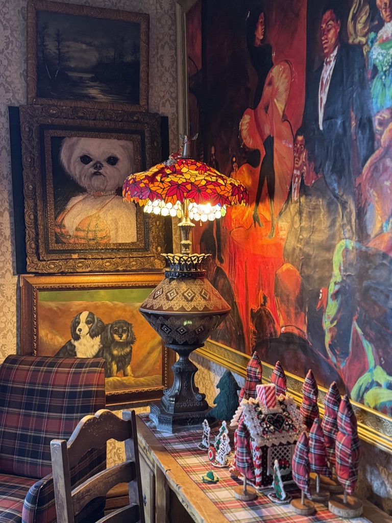 Stained-glass lamp and art in a richly decorated corner