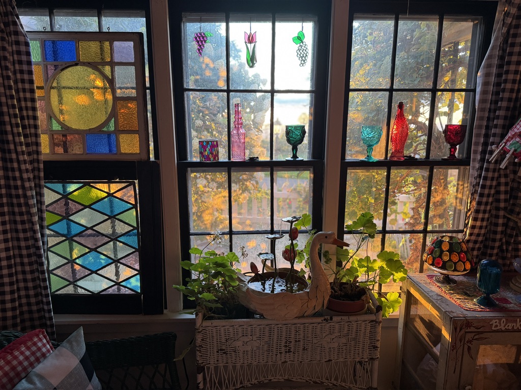 Colorful stained-glass windows and collected objects