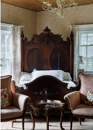 Bedroom with an ornate carved headboard