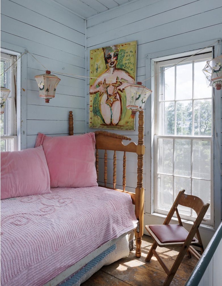 Bright sitting nook with a pink daybed
