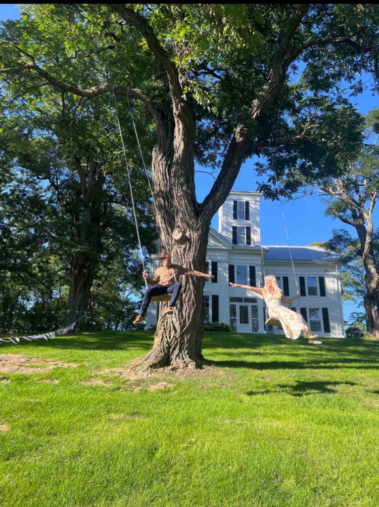 Wedding portrait beside the house and mature trees