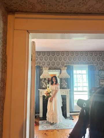 Bridal portrait seen through an interior doorway